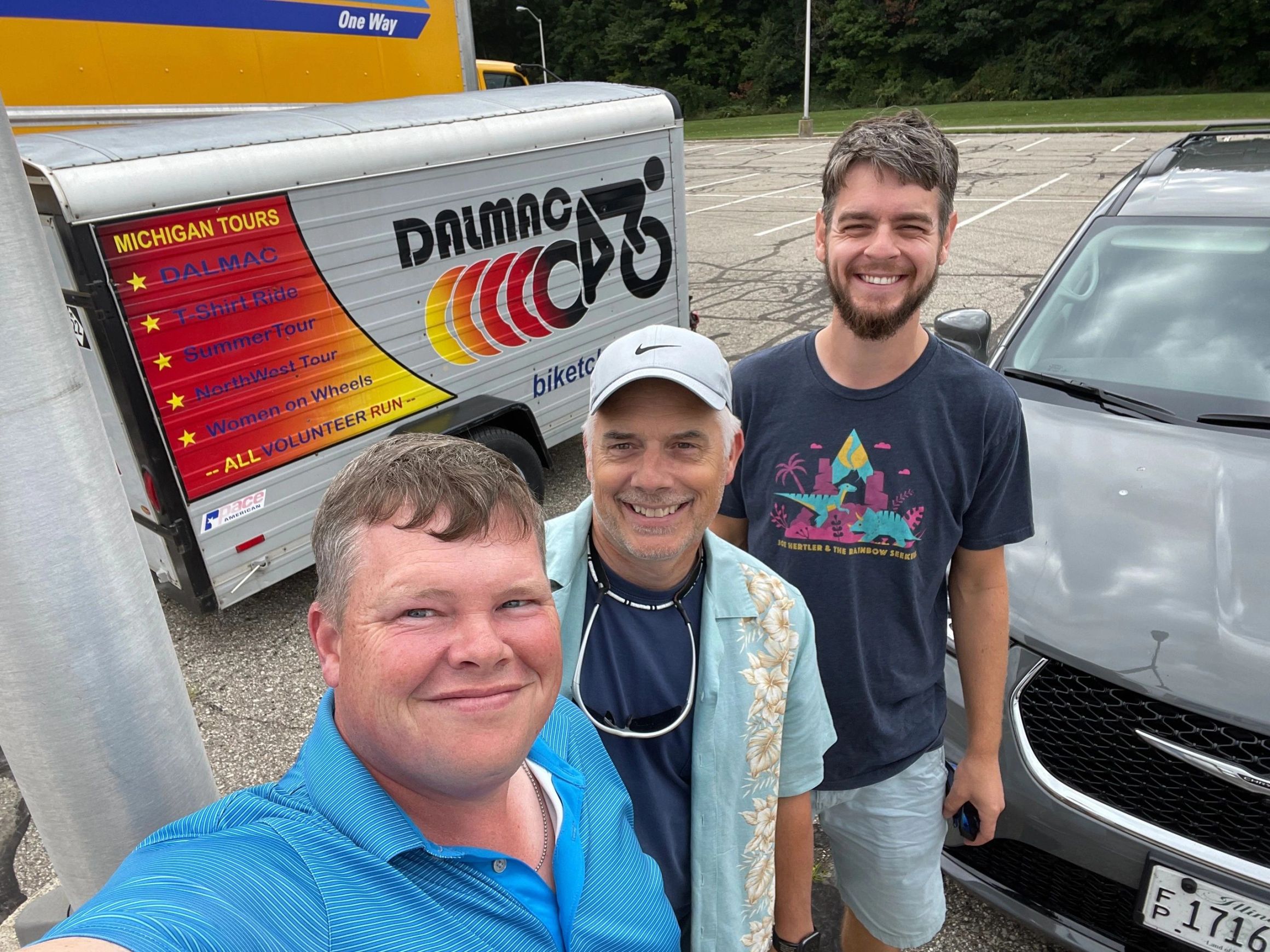 Three riders at the DALMAC gear trailer